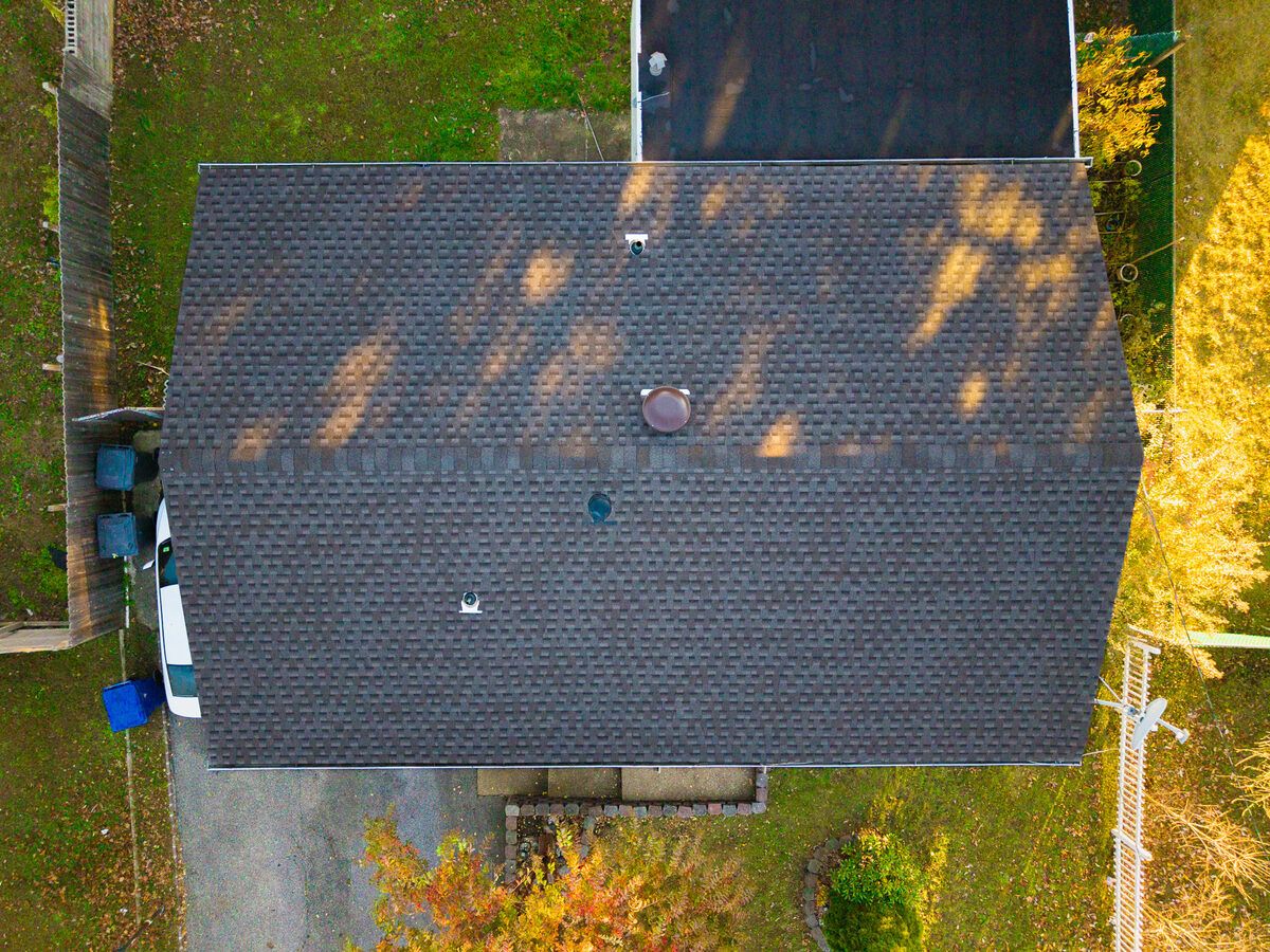 Aerial view of completed shingle roof — after