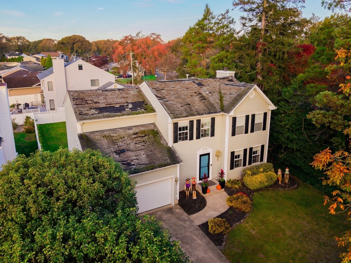 Colonial home roof replacement in Toms River — before